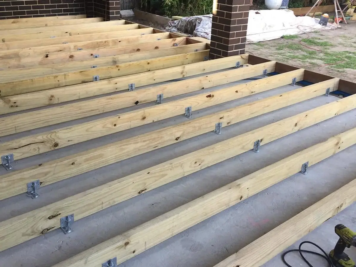Timber joists levelled over concrete